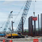 Pile driving rigs on site
