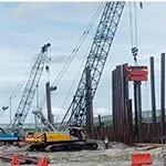 Pile driving rigs on site