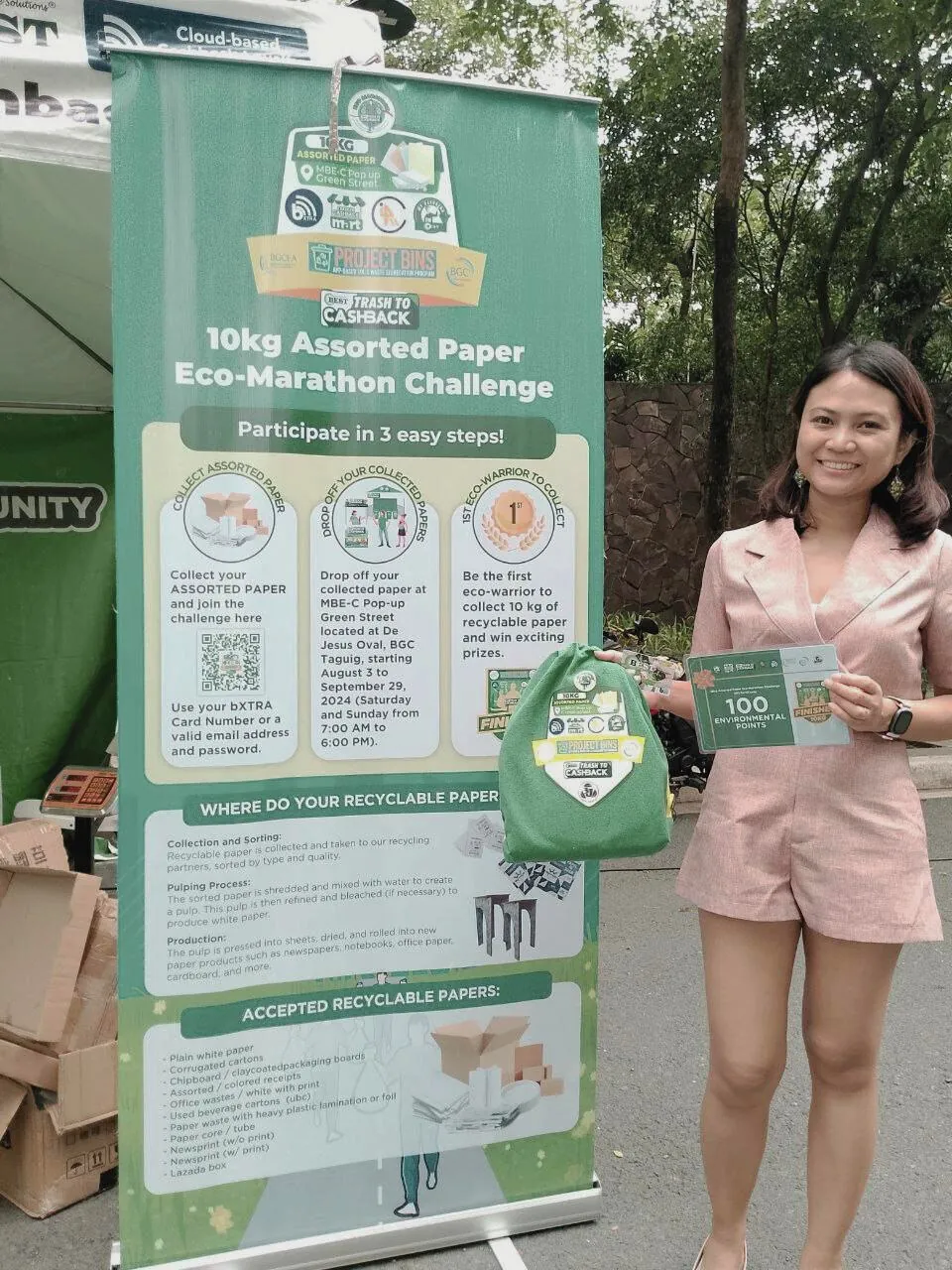 An Eco-Warrior with the Eco-Marathon Challenge banner and rewards kit