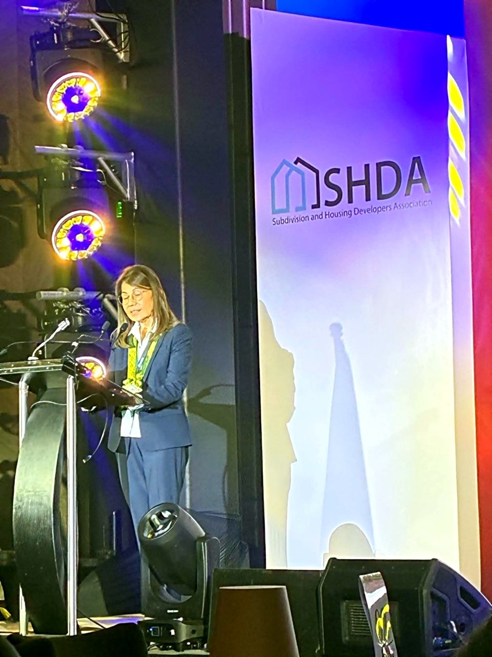 Isabelita Paredes Mercado delivering her address at the SHDA convention podium